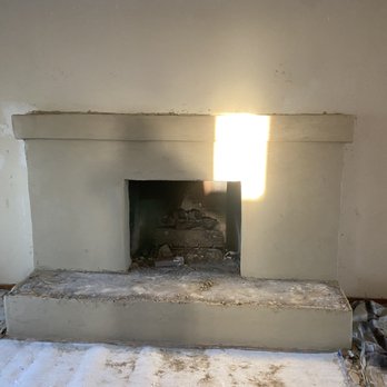 MTZ Construction - a fireplace in the middle of a room - General Contractors Near Me MTZ Construction - a fireplace in the middle of a room - General Contractors Near Me