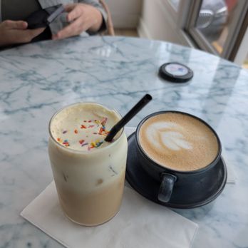 Issa Vibe Cafe - Birthday Cake Latte cold with dairy and Ube Lavender Latte hot dairy free - Salad Near Me - New Buffalo, Michigan Issa Vibe Cafe - Birthday Cake Latte cold with dairy and Ube Lavender Latte hot dairy free - Salad Near Me - New Buffalo, Michigan