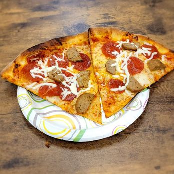 Cucinellas Pizza - two slices of pizza on a paper plate - Pizza Near Me - Jacksonville, Florida Cucinellas Pizza - two slices of pizza on a paper plate - Pizza Near Me - Jacksonville, Florida