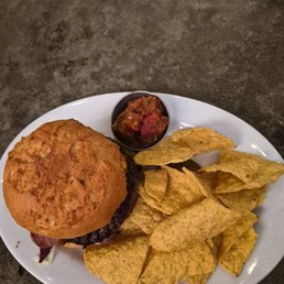 Gluten free bistro blue burger with chips and salsa. Gluten free bistro blue burger with chips and salsa.