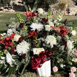 Conroy's Flowers - Arrangement ordered for a funeral service. This is what you get for $100.00. At least a third of the flowers were wilting and/or dead.