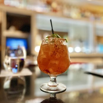 Mise En Place - a drink on a table - New American Near Me - Tampa, Florida Mise En Place - a drink on a table - New American Near Me - Tampa, Florida