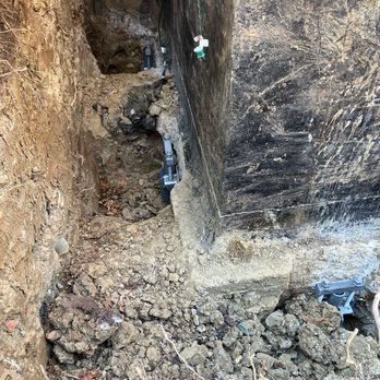 DMV Foundation Solutions - Helical piers in place. See the large horizontal crack in the foundation?! - Foundation Repair Near Me - Alexandria, Virginia