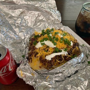 Oh'Mazing Potatoes and Que - Baconator Stuffed potato with all the fixins. BBQ sauce not added yet. - Barbeque Near Me - Spring, Texas