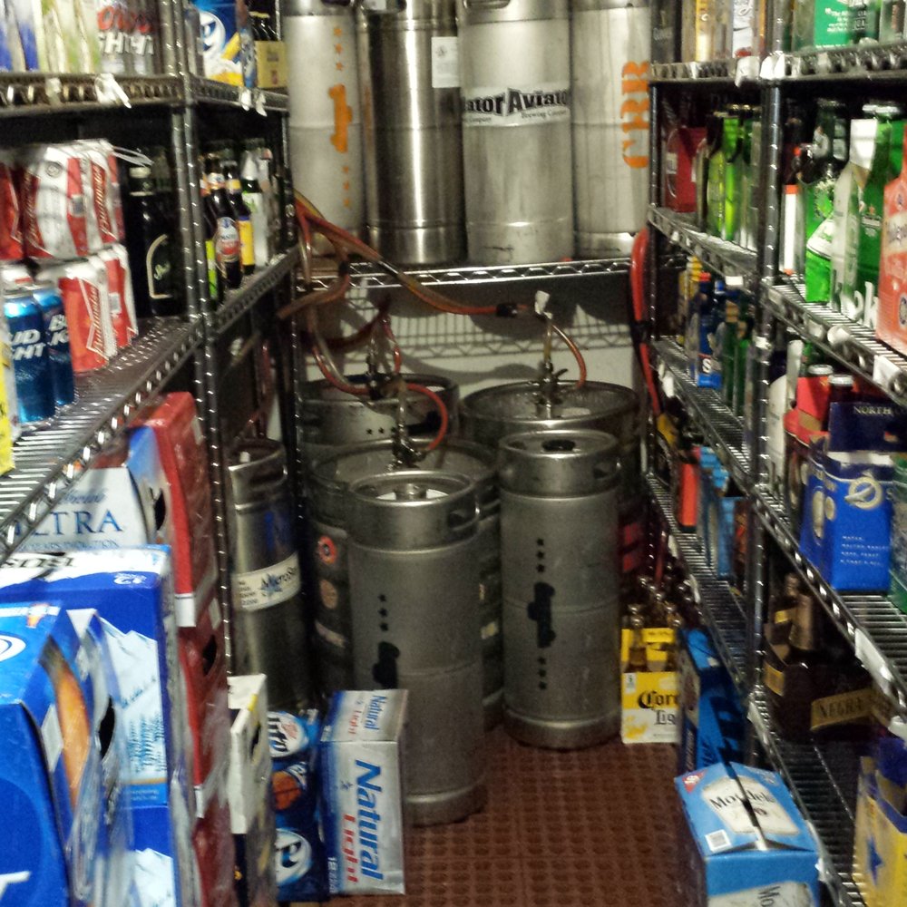 The Cork - They got a really good selection of craft beers. The beer cooler - Bars Near Me - Lexington, Kentucky