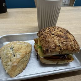 Scone, sandwich, latte Scone, sandwich, latte