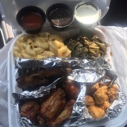 Ribs, chicken & fish combo plate with mac & cheese and Fresh Collard Greens