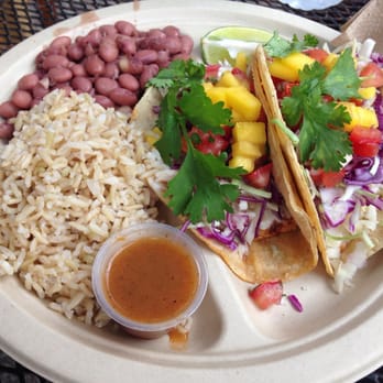 Haggo's Organic Taco - Cousteau fish tacos w/ organic cabbage slaw, cumin-lime crema, mango salsa cruda and cilantro, w/ sharp cheddar added - Tacos Near Me - Encinitas, California