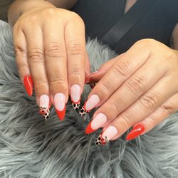 K&D Nails Salon - Bold red tips with fierce leopard-print details--the perfect mix of classy and wild