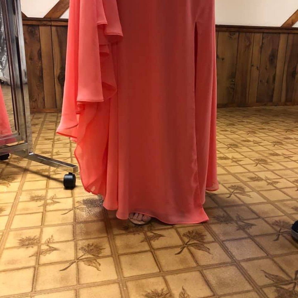 Pro Tailoring - bottom of dress is completely uneven. As you see, piece longer than other and foot is sticking out - Sewing & Alterations Near Me - Parma, Ohio Pro Tailoring - bottom of dress is completely uneven. As you see, piece longer than other and foot is sticking out - Sewing & Alterations Near Me - Parma, Ohio