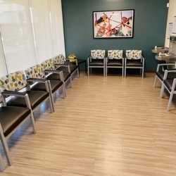 Orlando Health Physician Associates - Waiting area. There's a tv on the other end.