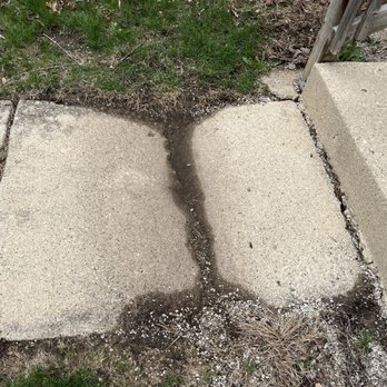 AI Elite Home Development - Front sidewalk slab before replacement - General Contractors Near Me
