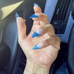 Blue waves french tip with cat eye design Blue waves french tip with cat eye design