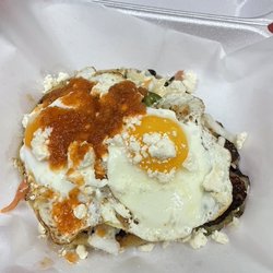 Allwayz Hungry - Breakfast Pupusa.  Pupusa of your choice, Layed with Salvadorian sour cream, pickled slaw, two sunny side up eggs, salsa& cojita cheese.