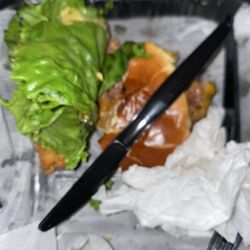 Sandys Sports Bar and Restaurant - Half of a dry tasteless burger.