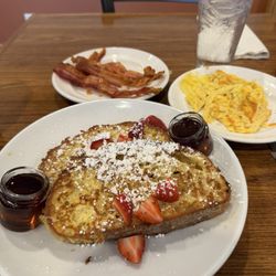 Sunny Street Cafe - French toast with strawberries, scrambled eggs and bacon.