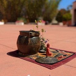 The Little Yoga Studio - Incense with small Buddha statue for the outdoor class.