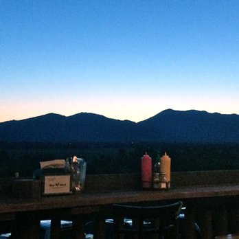 The Bird - Sunset view from the deck over the Tetons: ...Gone! Beautiful setting & great food! - American Near Me - Jackson, Wyoming The Bird - Sunset view from the deck over the Tetons: ...Gone! Beautiful setting & great food! - American Near Me - Jackson, Wyoming