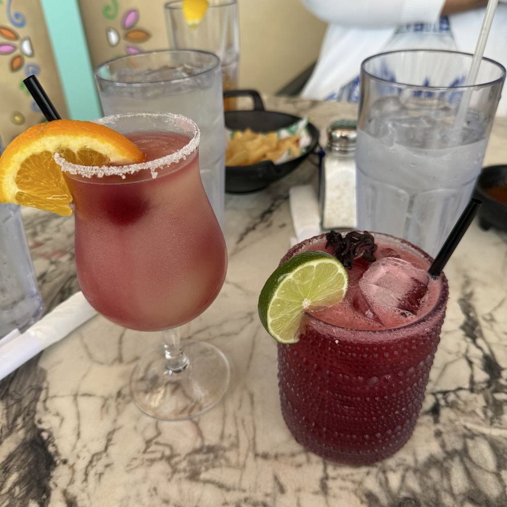 Casa Julia Tex Mex - On the left: Frozen Sangria Swirl Margarita | On the right: Frozen Hibiscus Margarita - Tex-Mex Near Me - New Caney, Texas