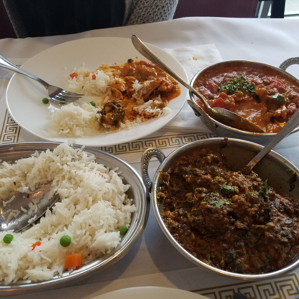 Taj Grill - In the rear, the Vegetable Makhani. In the front, the Chicken Palak. Both delicious and filling. The rice was for both of our meals. - Indian Near Me - Buffalo, New York Taj Grill - In the rear, the Vegetable Makhani. In the front, the Chicken Palak. Both delicious and filling. The rice was for both of our meals. - Indian Near Me - Buffalo, New York