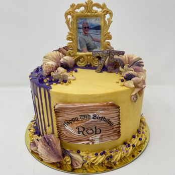 Happy Trails Kitchen - a yellow cake with a picture frame and seashells - Cupcakes Near Me Happy Trails Kitchen - a yellow cake with a picture frame and seashells - Cupcakes Near Me