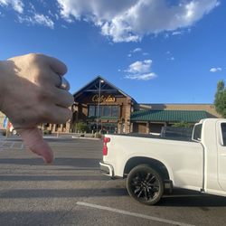 Bass Pro Shops - Me with my $70 purchase wishing I had never spent a dollar there with the pungence chauvinism that hits you as soon as you get to the door.