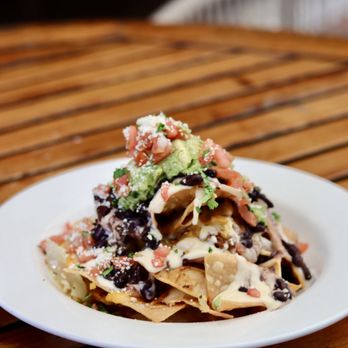 Dj's Bar and Grill - A crowd-pleaser. A game-changer. A must-order. Our Signature Loaded Nachos are the perfect starter or shareable. - Sports Bars Near Me - San Antonio, Texas Dj's Bar and Grill - A crowd-pleaser. A game-changer. A must-order. Our Signature Loaded Nachos are the perfect starter or shareable. - Sports Bars Near Me - San Antonio, Texas