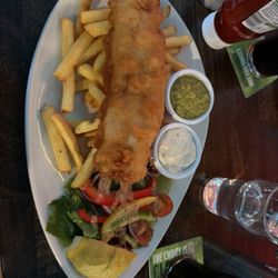 Padraicins Bar & Restaurant - Fish and Chips comes with side salad, lemon, mushed peas, and tarter sauce