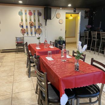 Gebeta Ethiopian Restaurant - Tables inside, hallway leading to the bathroom - Ethiopian Near Me - Portland, Oregon