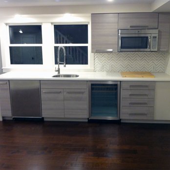 Trade Works Construction - a kitchen with stainless steel appliances - General Contractors Near Me Trade Works Construction - a kitchen with stainless steel appliances - General Contractors Near Me