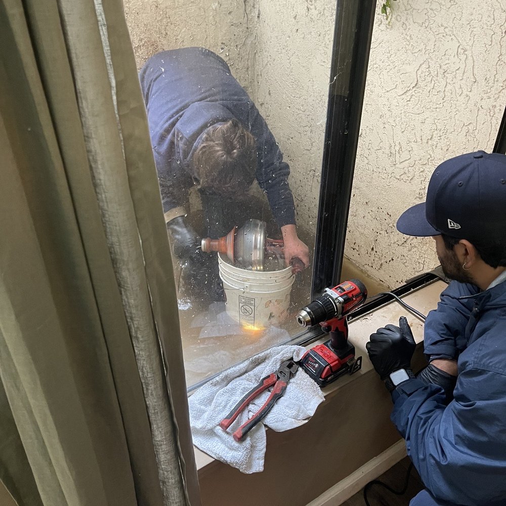 Brea/Orange County - Water flooded in an atrium on second floor of 3 floor condo. This tubing is supposed to flush our rain water. - Plumbing Near Me - Brea, California