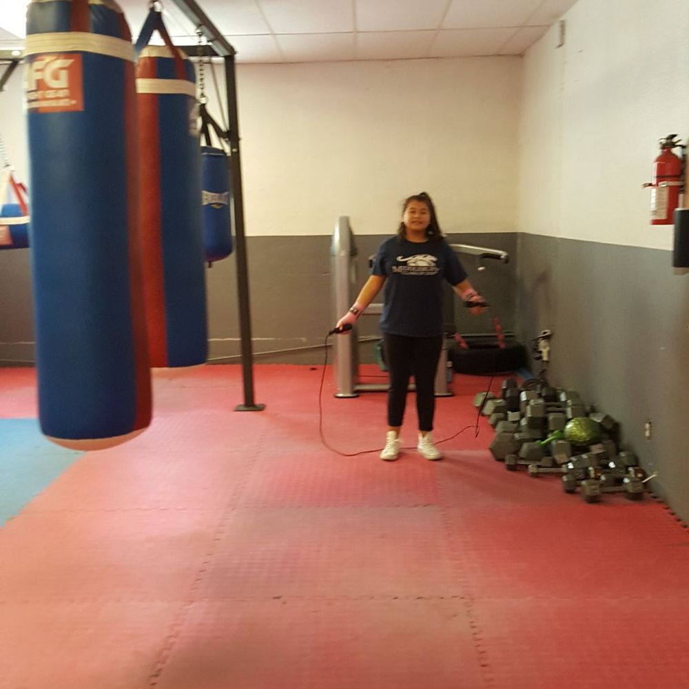 Jazmin doing jump rope before putting on the boxing gloves. Jazmin doing jump rope before putting on the boxing gloves.