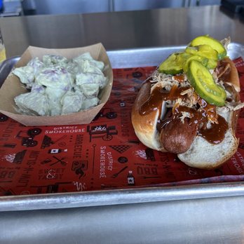 District Smokehouse - Smokehouse dog with a side of potato salad - Barbeque Near Me - Savannah, Georgia District Smokehouse - Smokehouse dog with a side of potato salad - Barbeque Near Me - Savannah, Georgia