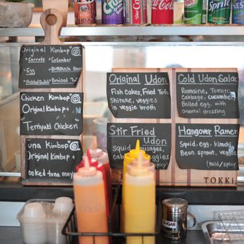 Tokki - menus on the counter of a restaurant - Korean Near Me - Coquitlam, British Columbia