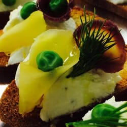 A Chef In My Kitchen Catering - Seasonal veggies on a Parmesan crostini  with homemade lemon ricotta and fresh dill.