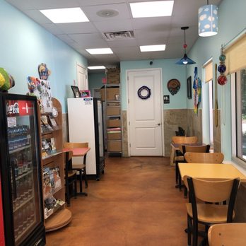 DeNucci's - A few small tables for seating - Ice Cream & Frozen Yogurt Near Me - Fernandina Beach, Florida