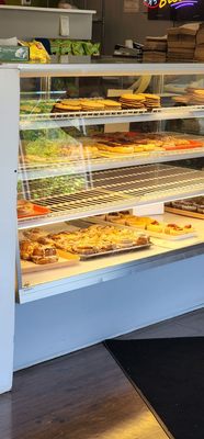 Photo of M & M Bakery and Deli - Kansas City, MO, US. a pizza display