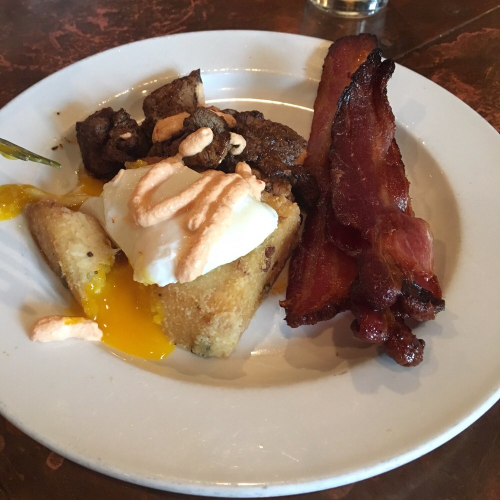 Otto's - Steak and eggs with potato cake special with a side of bacon. Yuuum - Breakfast & Brunch Near Me - Covington, Kentucky Otto's - Steak and eggs with potato cake special with a side of bacon. Yuuum - Breakfast & Brunch Near Me - Covington, Kentucky