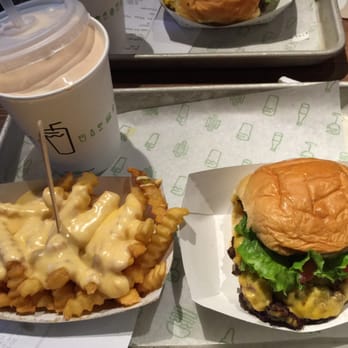 Shake Shack River North - The ShackBurger with cheese fries and a black & white shake. - Burgers Near Me - Chicago, Illinois Shake Shack River North - The ShackBurger with cheese fries and a black & white shake. - Burgers Near Me - Chicago, Illinois