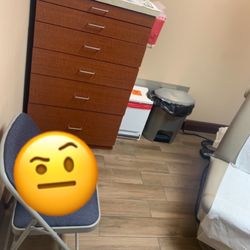 Dermatology & Skin Cance R Surgery Center - This chair seems out of place...and the exam chair(seen next to weird chair) is awfully close to the door. It's just a super tiny room.