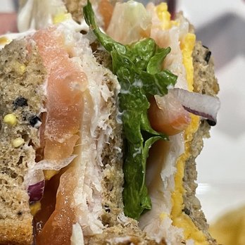 Tapas Sky Bar - a hand holding a sandwich - Tapas Bars Near Me - Denver, Colorado Tapas Sky Bar - a hand holding a sandwich - Tapas Bars Near Me - Denver, Colorado