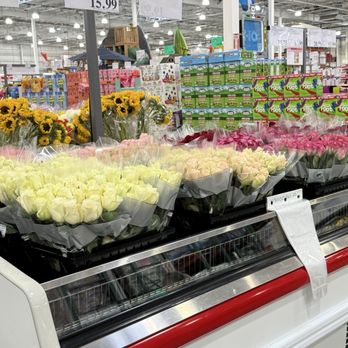 Costco Wholesale - Colorful bouquets of roses and sunflowers are arranged in a refrigerated display at Costco Wholesale in Albuquerque, NM. - Gas Stations Near Me - Albuquerque, New Mexico