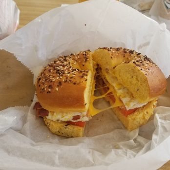 Bagel Joes - Bacon, egg and chesse with a slice of tomato on double sided egg everything bagel. - Bagels Near Me - Melbourne, Florida Bagel Joes - Bacon, egg and chesse with a slice of tomato on double sided egg everything bagel. - Bagels Near Me - Melbourne, Florida