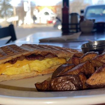 Karina De La Cruz - Waffle Breakfast Sandwich served with a side of homefries and syrup - Cafes Near Me - Lincoln, Rhode Island
