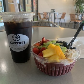 Kwench Juice Cafe - Tropical Bowl (with extra fruit toppings) and iced coffee. - Juice Bars & Smoothies Near Me - Naples, Florida Kwench Juice Cafe - Tropical Bowl (with extra fruit toppings) and iced coffee. - Juice Bars & Smoothies Near Me - Naples, Florida