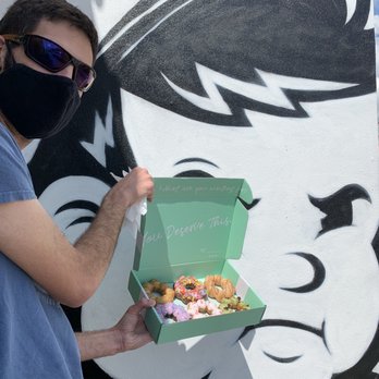 Dochi - My fiancé posing outside the Dochi shop with a half dozen, one of every flavor! - Donuts Near Me - Orlando, Florida Dochi - My fiancé posing outside the Dochi shop with a half dozen, one of every flavor! - Donuts Near Me - Orlando, Florida