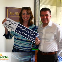 Shine On Signs and Graphics - Jennifer showing off her new sign from us for Windermere!