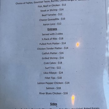 Rustic River Restaurant - More menu - A printed menu from Touch of Mexico displays various Mexican cuisine options, including fajitas, tacos, burritos, chimichangas, quesadillas, and seafood dishes like fish, shrimp, and crab cakes. It lists prices for entrees, sides, and additional items, with some dishes served with sides or in platters. The menu is organized into sections with item descriptions and prices, including options like grilled shrimp, salmon, and chicken, along with side dishes such as fries, salads, and mashed potatoes. - American Near Me - Tazewell, Tennessee