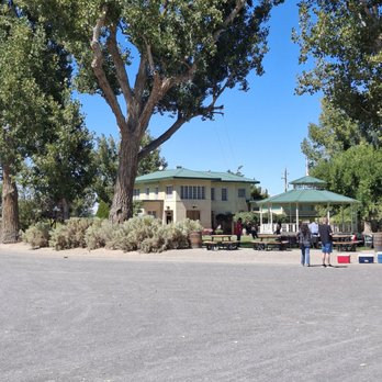 Frey Ranch Farmers + Distillers - The main residence on the property.  If you can see it, there is a long rope swing on the tree. - Distilleries Near Me - Fallon, Nevada