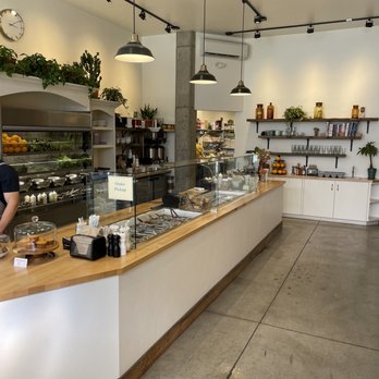 Basal - a man standing at a counter in a bakery - Salad Near Me - Missoula, Montana Basal - a man standing at a counter in a bakery - Salad Near Me - Missoula, Montana